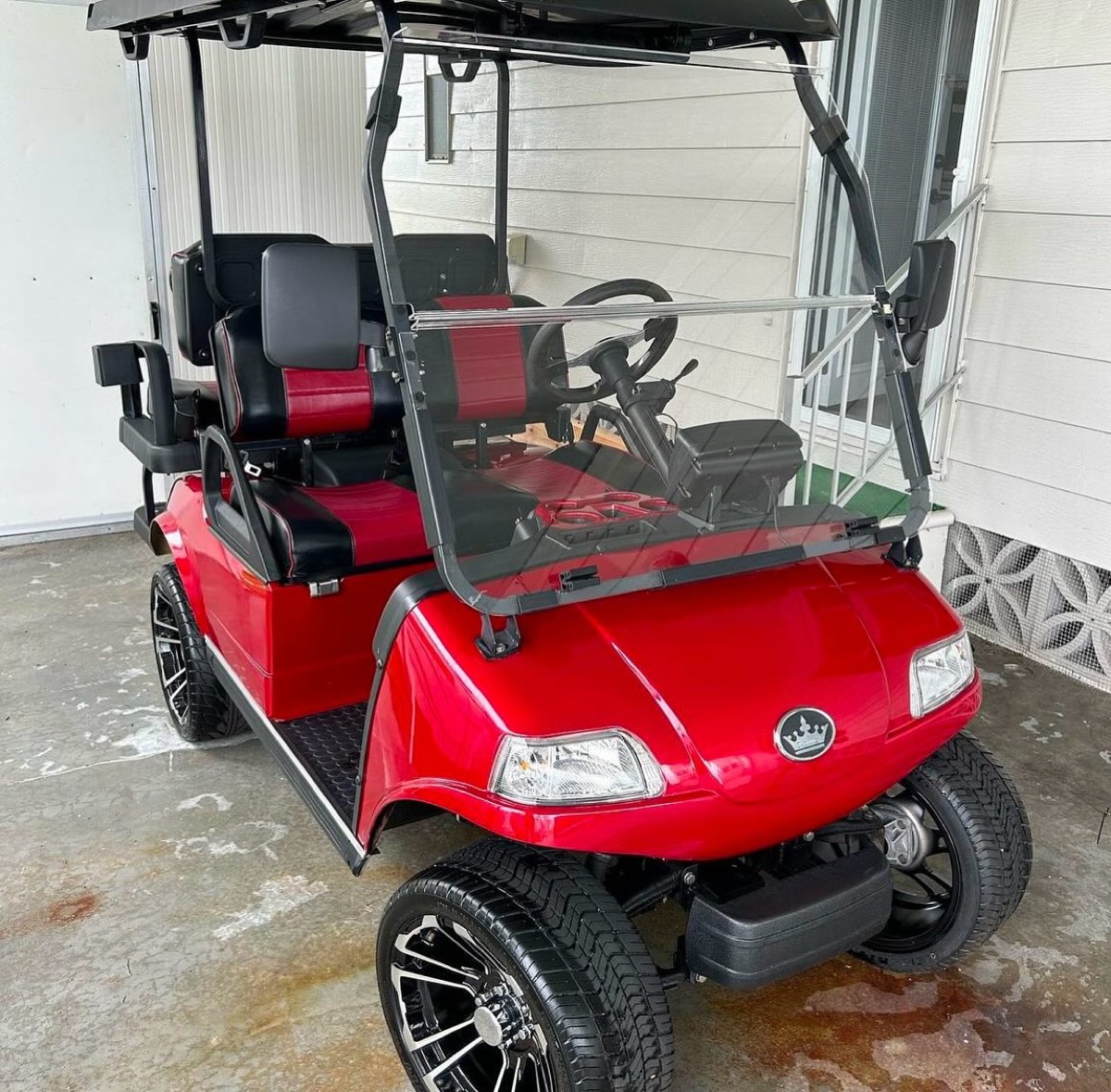 Red golf cart cleaned and detailed inside and out