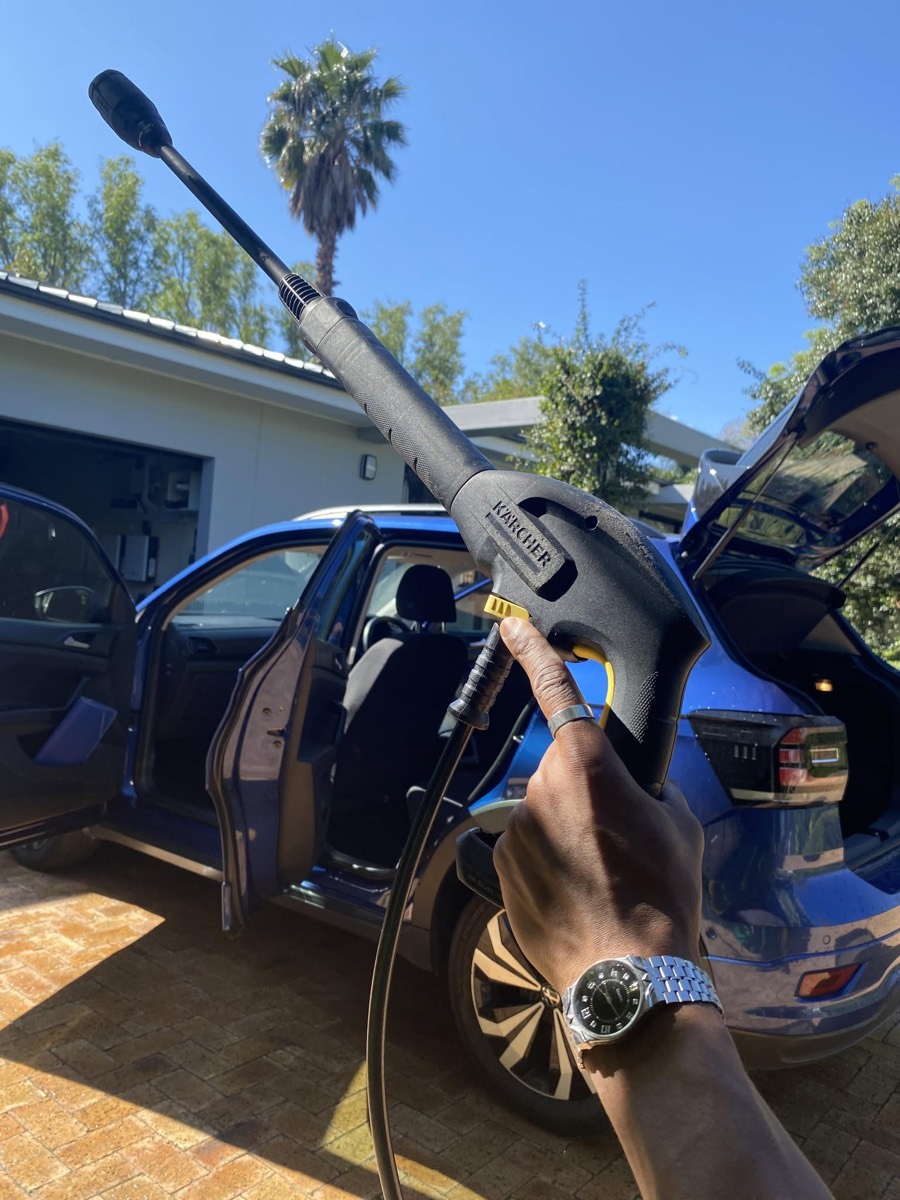 Blue Volkswagen T-Cross being foam washed in a driveway